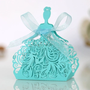 Close-up of laser-cut Tiffany blue candy box in elegant princess dress shape with ribbons