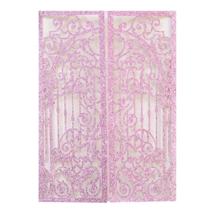 Close-up of pink glitter laser-cut butterfly gate pattern on a wedding invitation cover