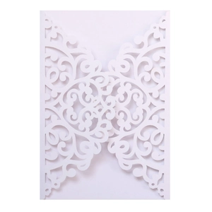 Elegant white laser-cut wedding invitation cover with intricate floral lace patterns