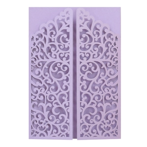 Detail of lavender laser-cut invitation with pearlescent finish and floral hollow pattern