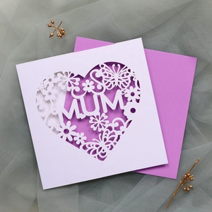 Laser-cut greeting card with heart-shaped floral patterns and purple envelope