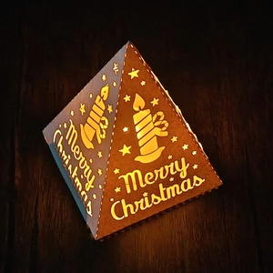 Pyramid Christmas paper lantern with hollow star design and warm LED candle light glow