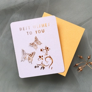 Detailed laser cut butterfly card with Best Wishes text and golden glitter layer