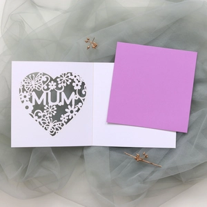 Detail of laser-cut MUM greeting card with floral butterfly patterns and purple insert