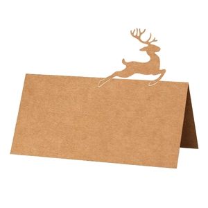 Brown kraft paper table tent card featuring a laser-cut reindeer silhouette for Christmas
