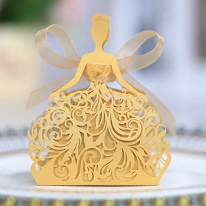 Detail of laser-cut gold wedding favor box featuring an elegant princess silhouette