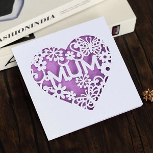 Laser cut Mother's Day card with MUM floral design and purple butterflies on white paper