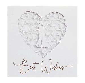 Macro detail of laser-cut heart and vine pattern on elegant white greeting card