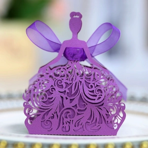 Macro detail of laser-cut purple princess dress candy box with elegant ribbon bow