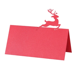 Red Christmas deer laser-cut place card made of textured paper in a 3D folded design
