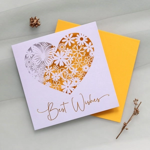 Detail of laser-cut heart and butterfly card with gold foil Best Wishes and yellow envelope