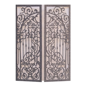 Macro detail of laser-cut glitter paper wedding invitation with elegant floral gate pattern