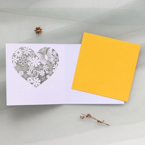 Laser-cut floral heart butterfly greeting card with yellow insert on grey mesh