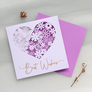 Detail of laser-cut heart butterfly card with gold Best Wishes foil and purple envelope