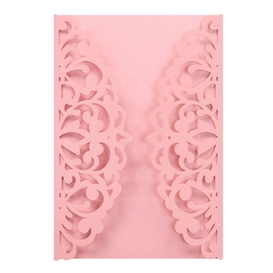 Pink laser-cut pearlescent paper wedding invitation covers with ornate floral patterns