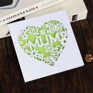 Detailed laser cut Mother's Day card with MUM letters and green butterflies on wood