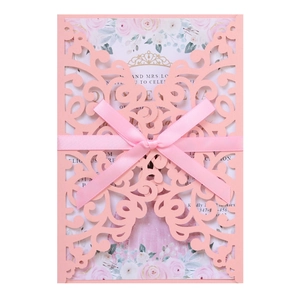 Pink laser-cut wedding invitation set with floral inner card and silk bow tie