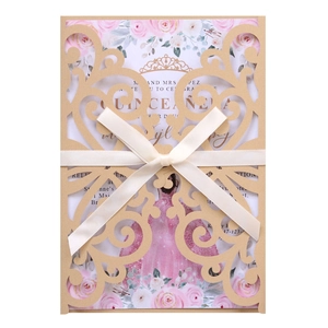 Laser cut Quinceañera invitation in champagne gold with elegant floral ribbon detail