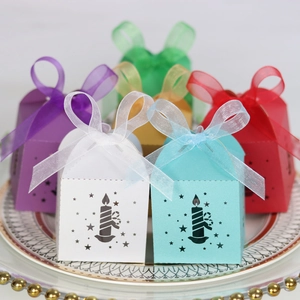 Detailed view of hollow star gift boxes in multiple colors with matching organza ribbons