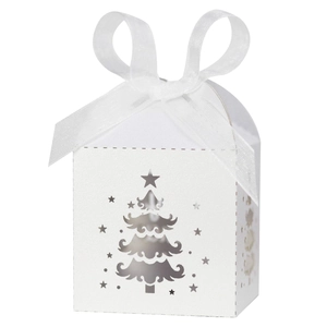 Close-up of white card paper gift box featuring laser-cut Christmas tree and chiffon ribbon
