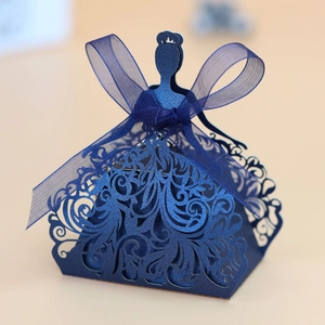 Detail of laser cut princess dress candy box in blue pearl paper with a sheer ribbon bow