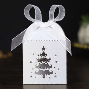 White laser-cut Christmas tree candy box with sparkling pearlescent finish and white ribbon