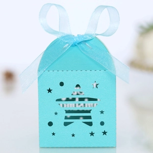 Detail of cyan star-shaped hollow gift box with light blue translucent ribbon bow
