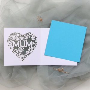 Close-up of laser-cut heart and MUM lettering on elegant floral greeting card