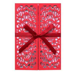 Red laser-cut wedding invitation card with Double Happiness character and silk ribbon