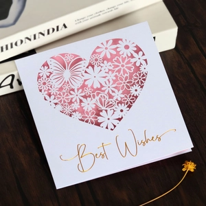 Detail of laser-cut butterfly heart card with pink insert and gold foil Best Wishes text