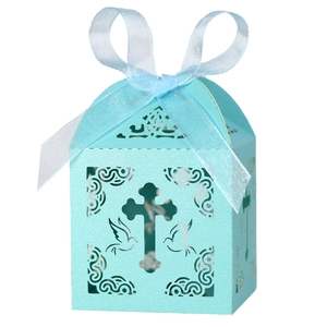 Detailed laser-cut white cross and dove pattern on Tiffany blue party favor candy box