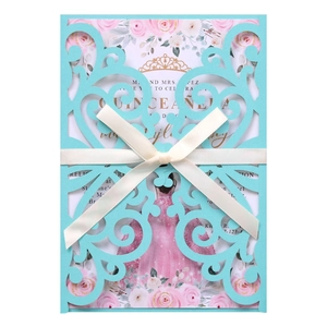 Laser cut quinceañera invitation with teal window sleeve and champagne satin bow