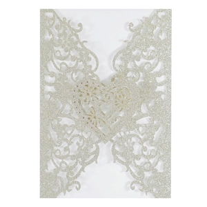 Detailed laser-cut hollow heart invite cover with glitter texture for wedding invitations