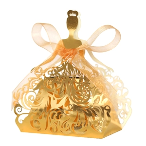Detailed laser-cut gold princess candy box with an orange organza ribbon bow
