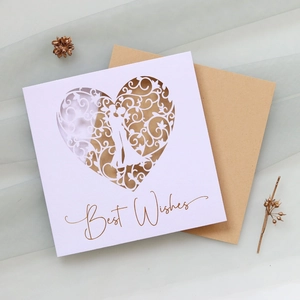Laser-cut heart silhouette greeting card with golden Best Wishes text and kraft envelope