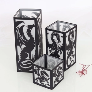 Three-piece black dragon paper lantern set with intricate hollow cutouts in various sizes