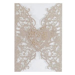 Laser cut champagne glitter invitation pocket with floral patterns and center heart detail