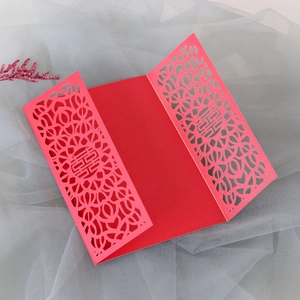 Detailed laser-cut hollow floral pattern and Double Happiness sign on red wedding card