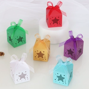 Hollowed-out star pattern gift boxes in six colors with sheer organza ribbon bows