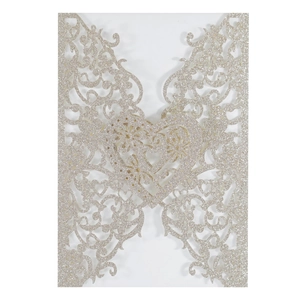 Champagne gold glitter wedding invitation cover with laser cut floral heart pattern