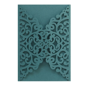 Elegant dark teal laser-cut wedding invitation cover with intricate floral damask patterns