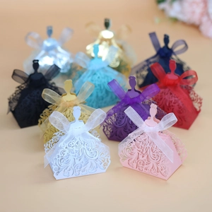 Laser-cut girl silhouette favor boxes with silk ribbons in various vibrant colors
