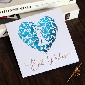 Detail showing laser-cut heart pattern and gold foil Best Wishes on white card