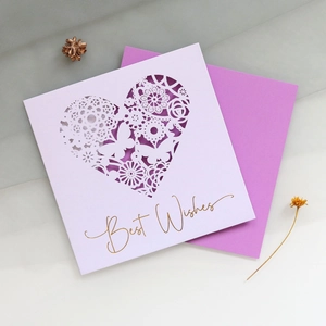 Laser-cut heart-shaped invitation card with gold butterfly pattern and Best Wishes text