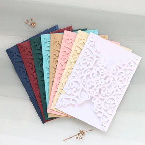 Laser-cut wedding invitations in multiple colors with elegant European patterns