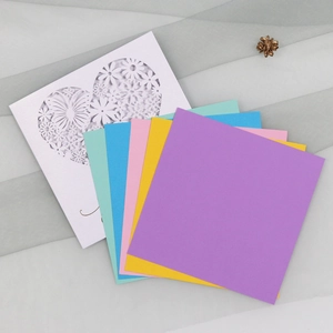Detail of laser-cut heart card with butterflies and multi-colored paper inserts