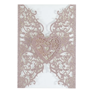 Laser cut rose gold glitter wedding invitation cover with intricate heart vine pattern