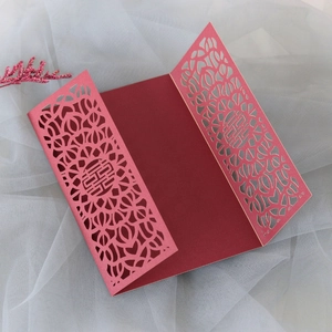 Detailed laser-cut hollow pattern and red Xi character on traditional Chinese wedding card