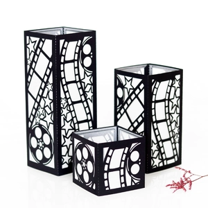 Detailed view of 3-piece film theme black paper lantern covers with movie film patterns