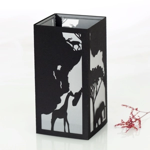 Detail view of black paper lantern with silhouette of African animals and giraffe